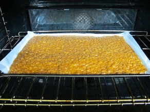 Baking toffee matzo in the oven.