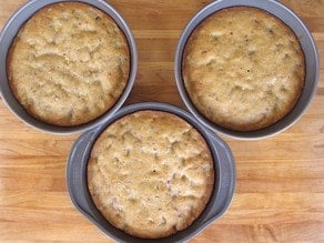 Three round cake layers in pans.