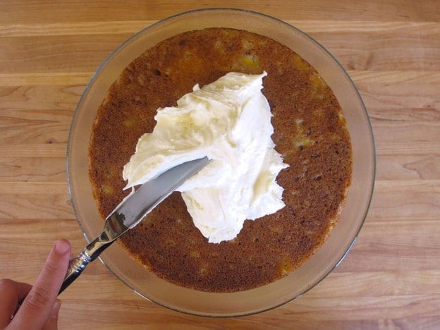 Adding a second layer to a cake.