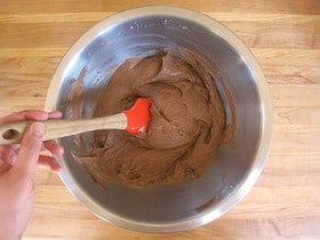 Chocolate stirred into butter for cake.