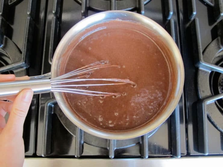 Sweetened condensed milk and cocoa in a saucepan.