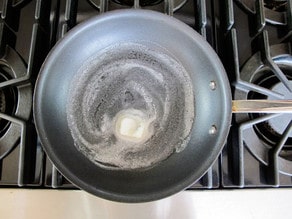 Melted butter in a nonstick skillet.