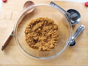 Graham cracker crumbs in a mixing bowl.