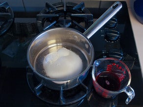 Sugar in a saucepan for cherry topping.
