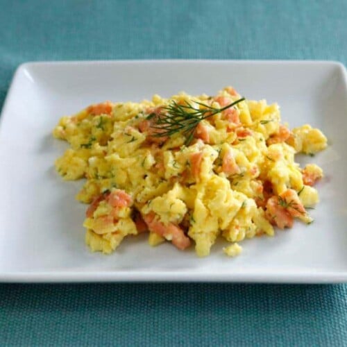 Smoked Salmon Goat Cheese Scramble - Irresistible breakfast recipe with fluffy scrambled eggs, creamy goat cheese, smoked salmon and fresh dill by Tori Avey.