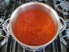 Milled tomatoes in a stockpot.