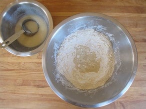 Making a well in flour for wet ingredients.