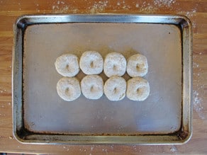 Cut out biscuits on a baking sheet.