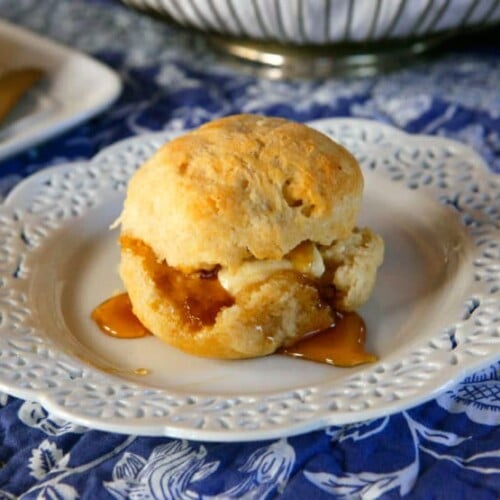 Easy buttery and delicious biscuit served on a fancy plate with delicious syrup