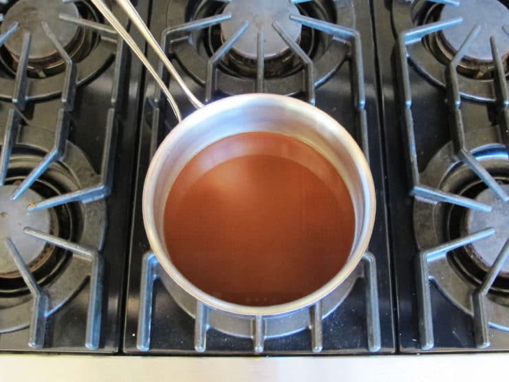 Strained date liquid in a saucepan.