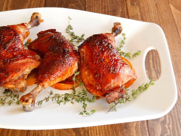 Date Glazed Orange Chicken - Sweet, flavorful recipe for orange and thyme-marinated roasted chicken glazed with date honey. Lovely holiday recipe.