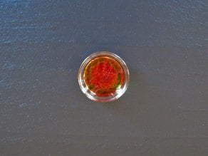 Saffron threads in water.
