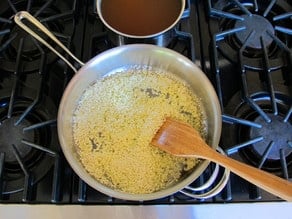 Toasting rice in a saute pan.