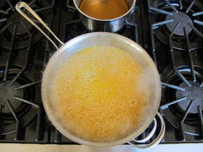 Cooking risotto in chicken stock.