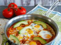 A delicious and flavorful Mexican breakfast skillet of Huevos Shakshukos with eggs, tomatoes, peppers, and spices