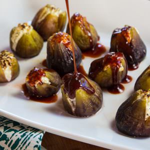 Pouring honey over stuffed figs.