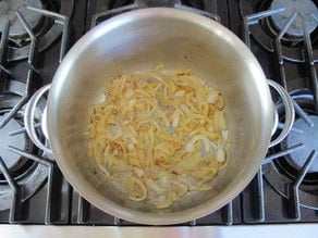 Sauteeing sliced onions.