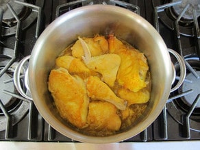 Chicken pieces added to broth.
