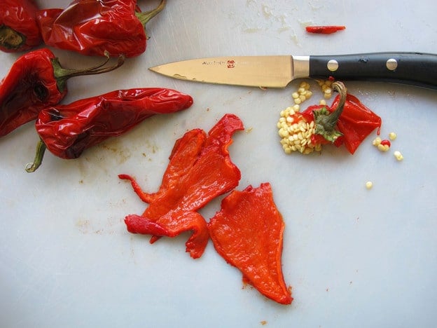 Seeding and stemming roasted peppers.