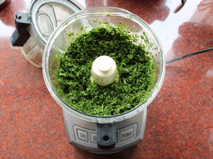 Yemenite Schug on a blender mixed with a spicy herb, garlic, and pepper