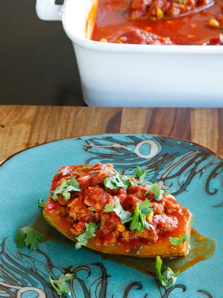 Stuffed Zucchini with ground beef or lamb, pine nuts, tomato sauce and spices. Low carb, paleo, gluten free, grain free.