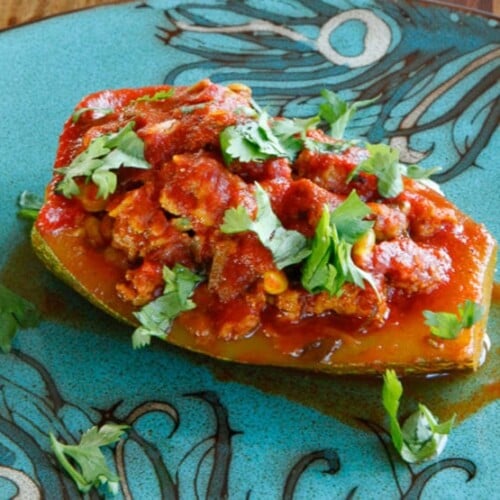 Stuffed Zucchini with ground beef or lamb, pine nuts, tomato sauce and spices. Low carb, paleo, gluten free, grain free.