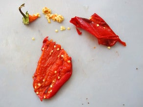 Seeding and peeling roasted peppers.