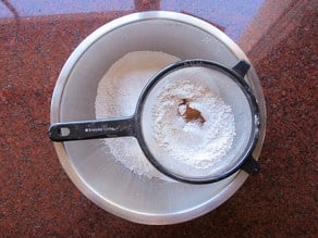 Sifting flour for cake.