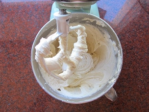 Fluffy cake batter in a mixer.