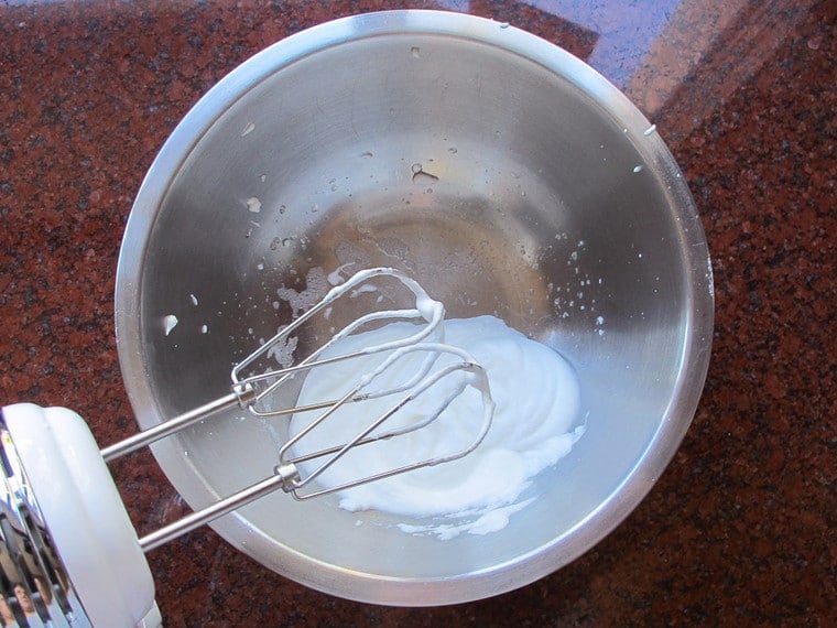Beating egg whites in a bowl.