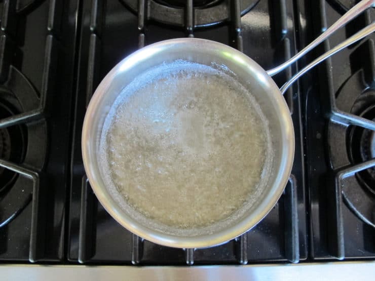 Sugar and water in a saucepan.
