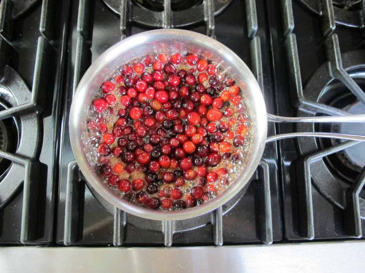 Cranberries added to orange juice.