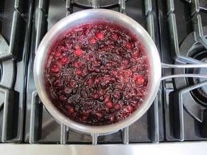 Cranberries bursting in a pot.