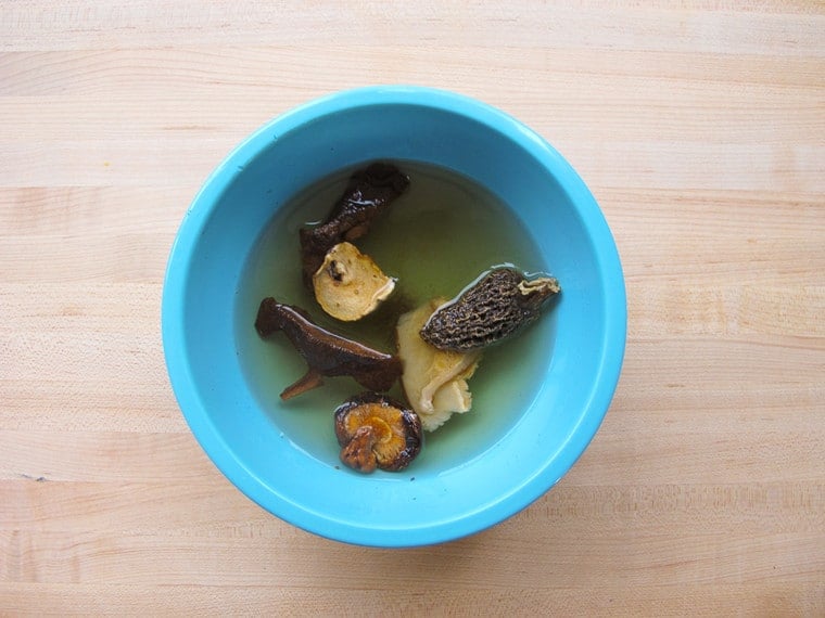 Dried mushrooms soaking in water.