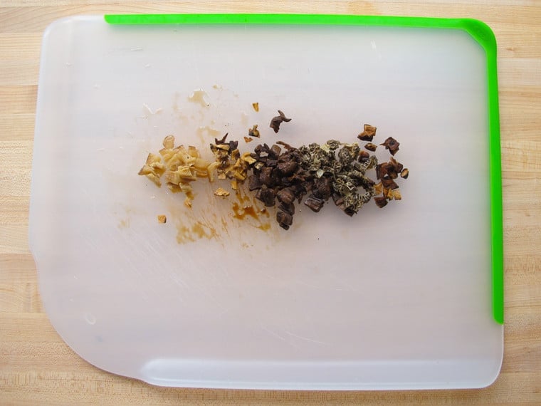 Chopped mushrooms on a cutting board.