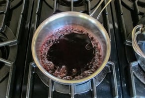 Cherry juice boiling on the stove.