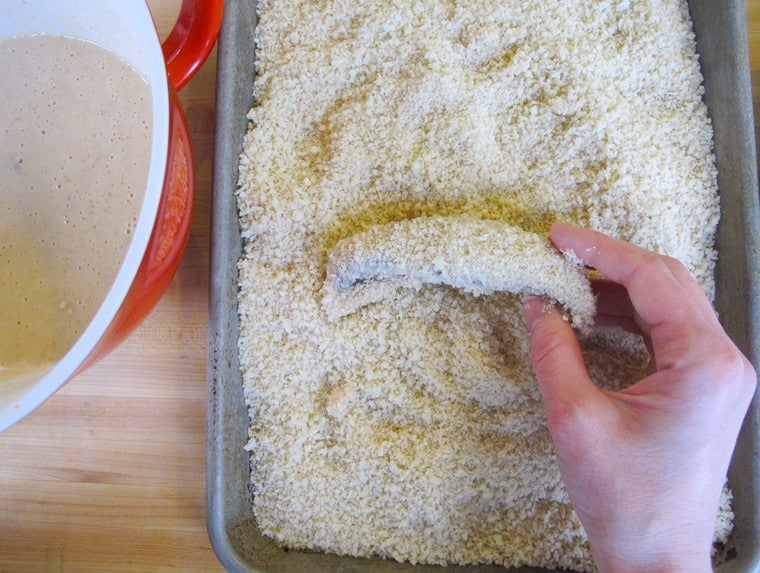 Breading mushrooms with panko.