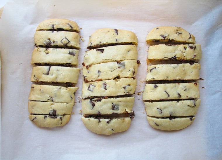 Almost cook Dark Chocolate Cherry Mandelbrot cut in to pieces while on a baking sheet