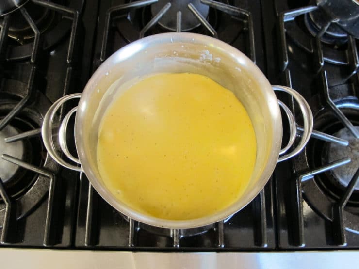 Adding cheese to a roux.