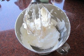 Whipped cream in stand mixer.