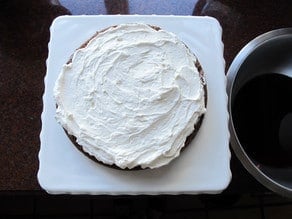 Whipped cream on cake layer.