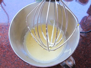 Eggs and sugar in mixer bowl.