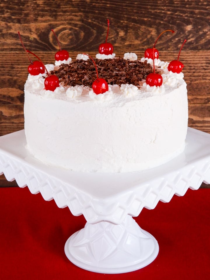 American Cakes - Black Forest Cake Recipe and History from food Historian Gil Marks. Chocolate Layer Cake with Whipped Cream Frosting and \"Drunken\" Cherries. 