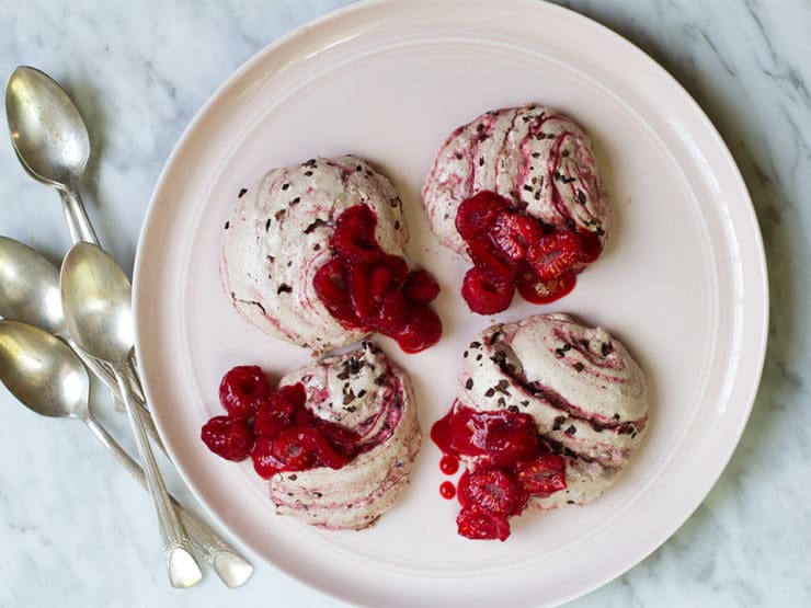 Decadent raspberry cacao ripple rochers on a white plate with spoons