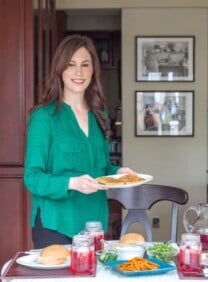 Tori Avey serving meal in kitchen