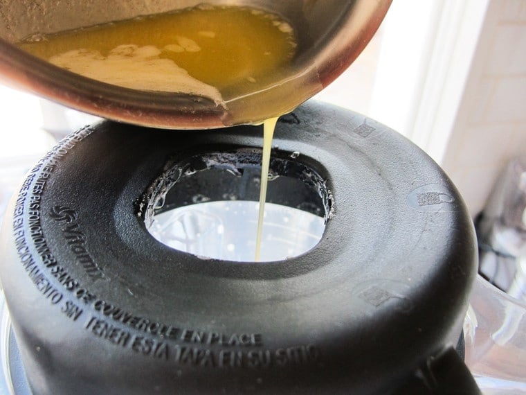 Adding butter to running blender.