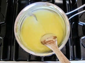 Finished lemon curd in saucepan.