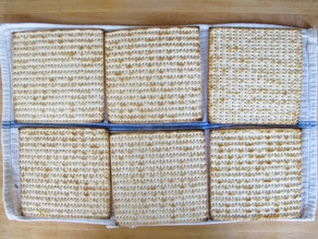 Matzo crackers on a dish towel.