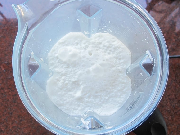 Water and shredded coconut in blender.
