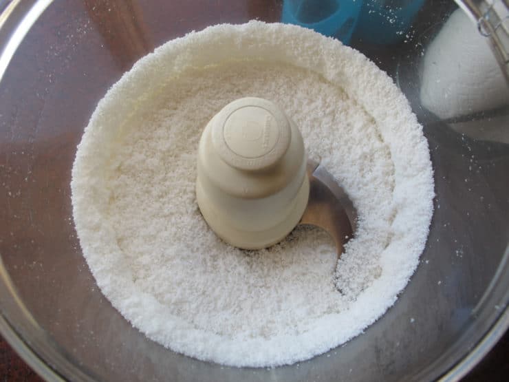 Dried coconut in a food processor.
